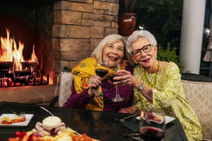 Women by bistro fireplace