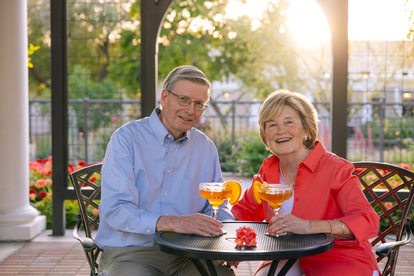 Couple with drinks in gazebo