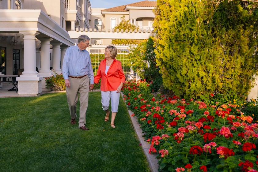 Senior couple holding hands on a walk