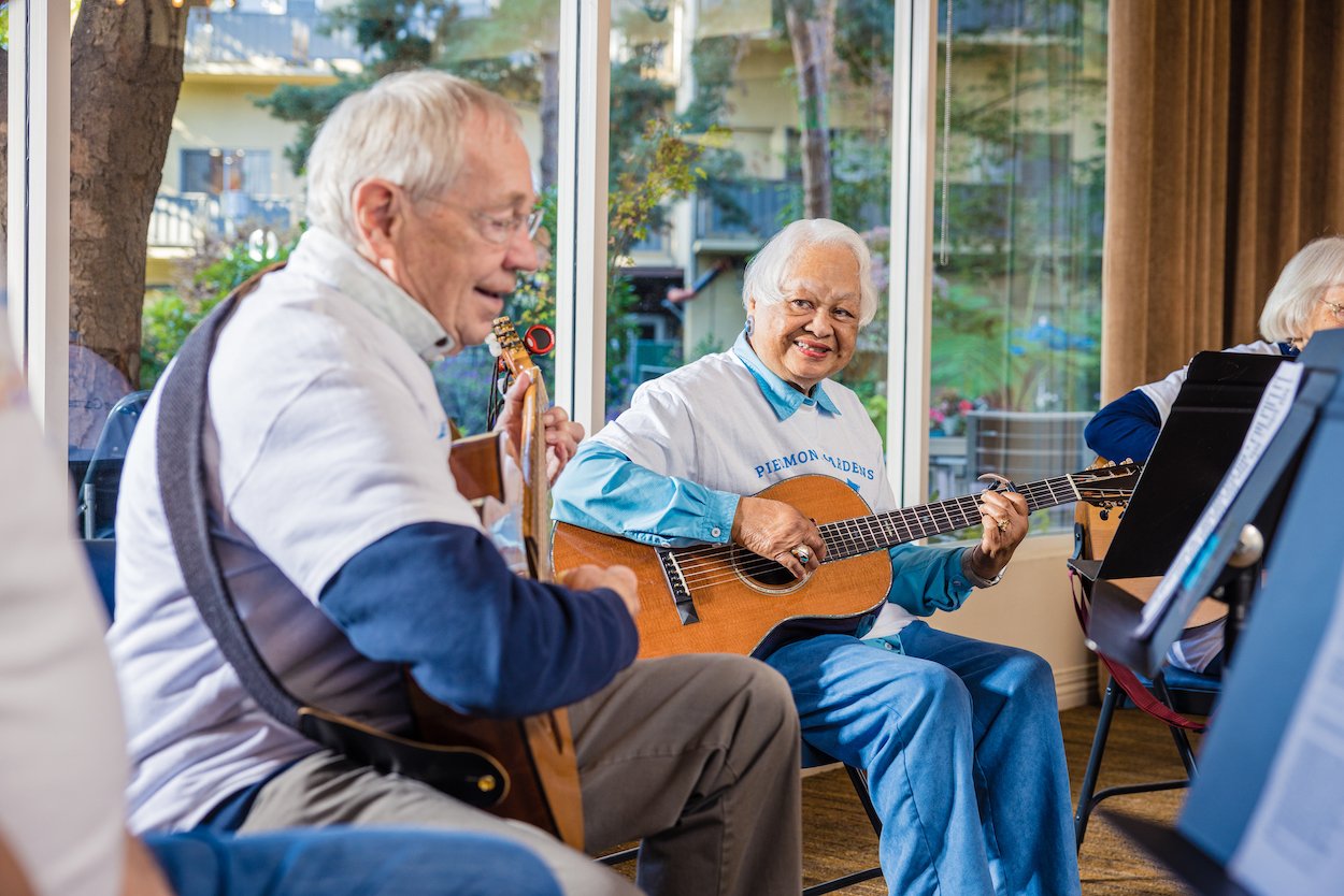 two friends playing instruments together