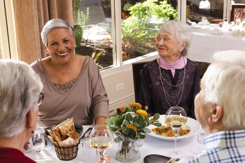 friends smiling at dinner table