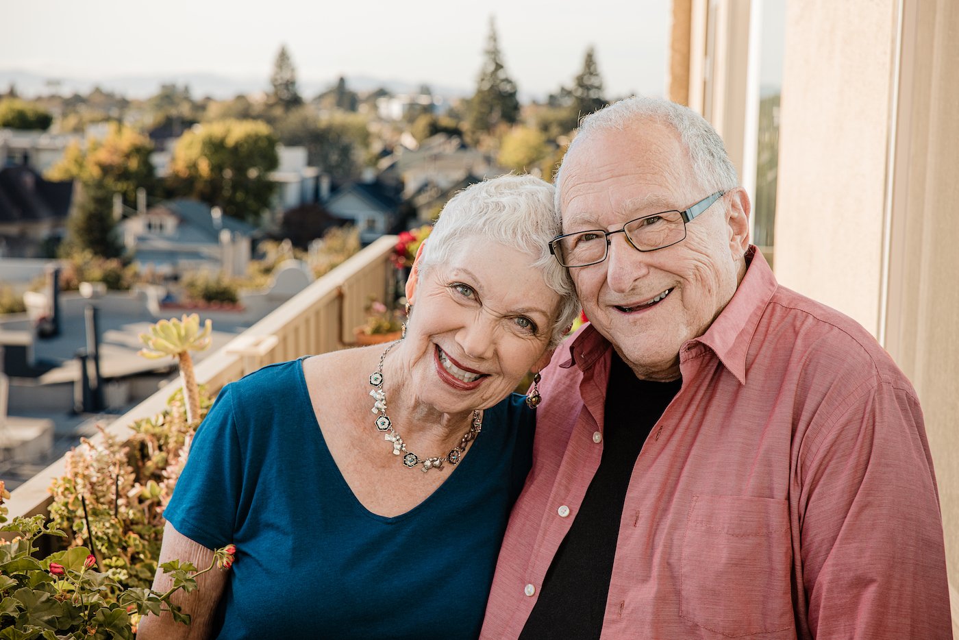 couple smiling on balcony