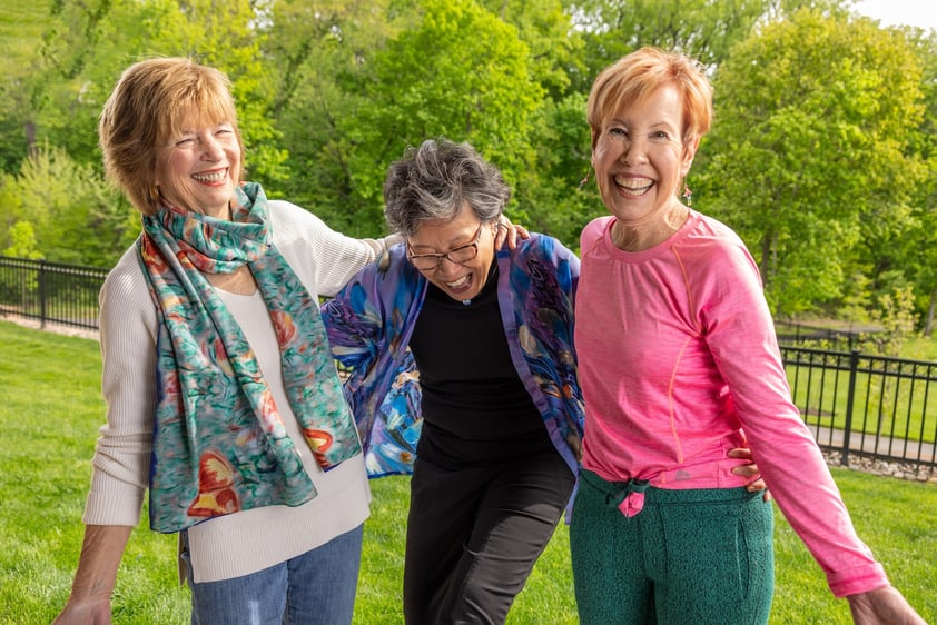 Three senior women outside