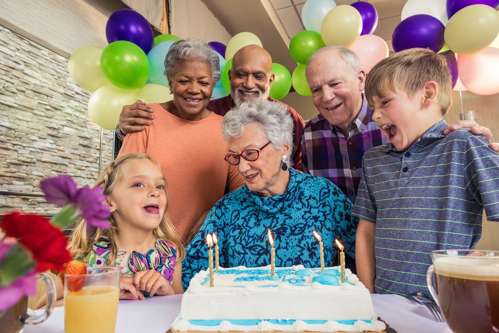 older woman celebrating birthday with family