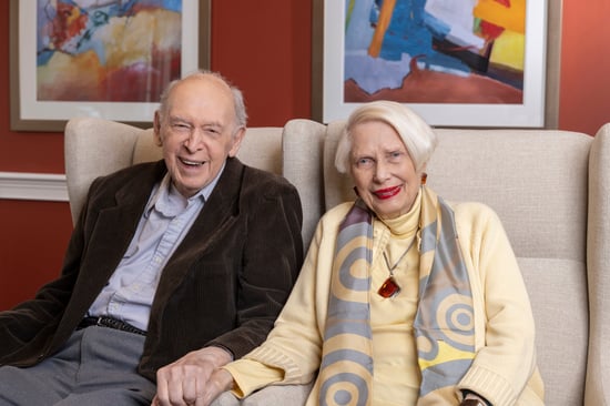 Jerry and Tania holding hands and smiling