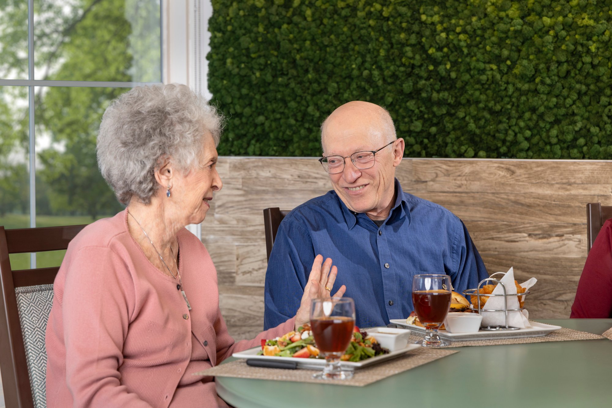 Senior couple enjoying a delicious meal.