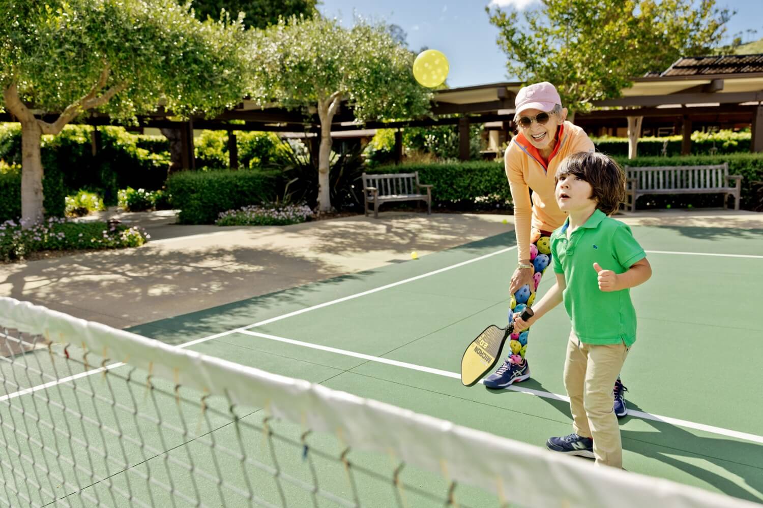 Teaching pickleball to child