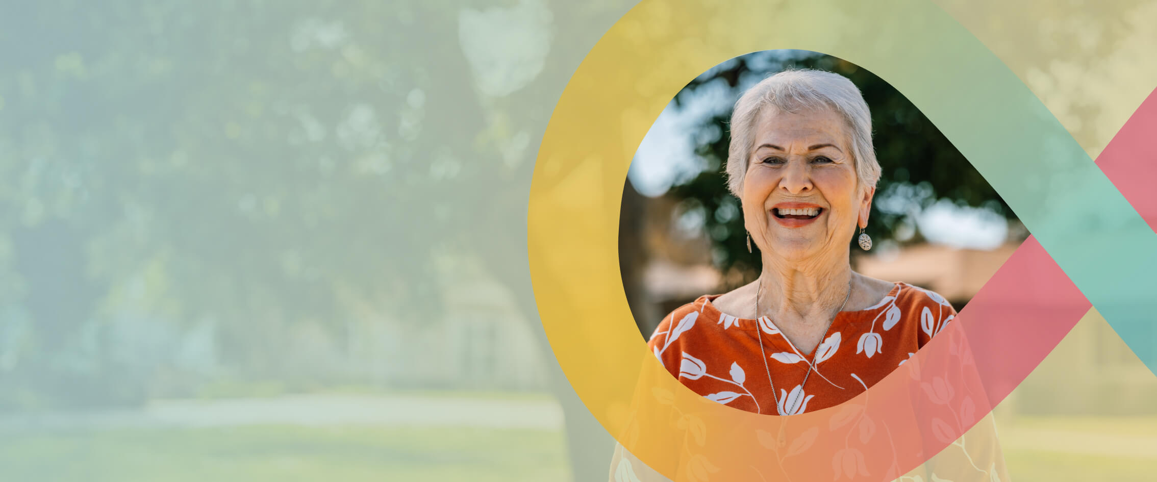Smiling senior woman standing outside in a HumanGood Life Plan Community