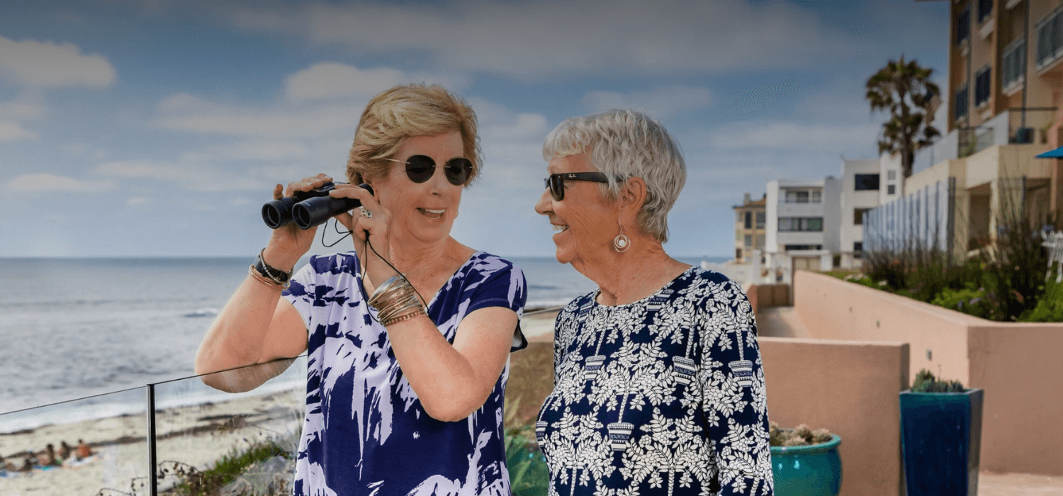 Two residents look out over the ocean.