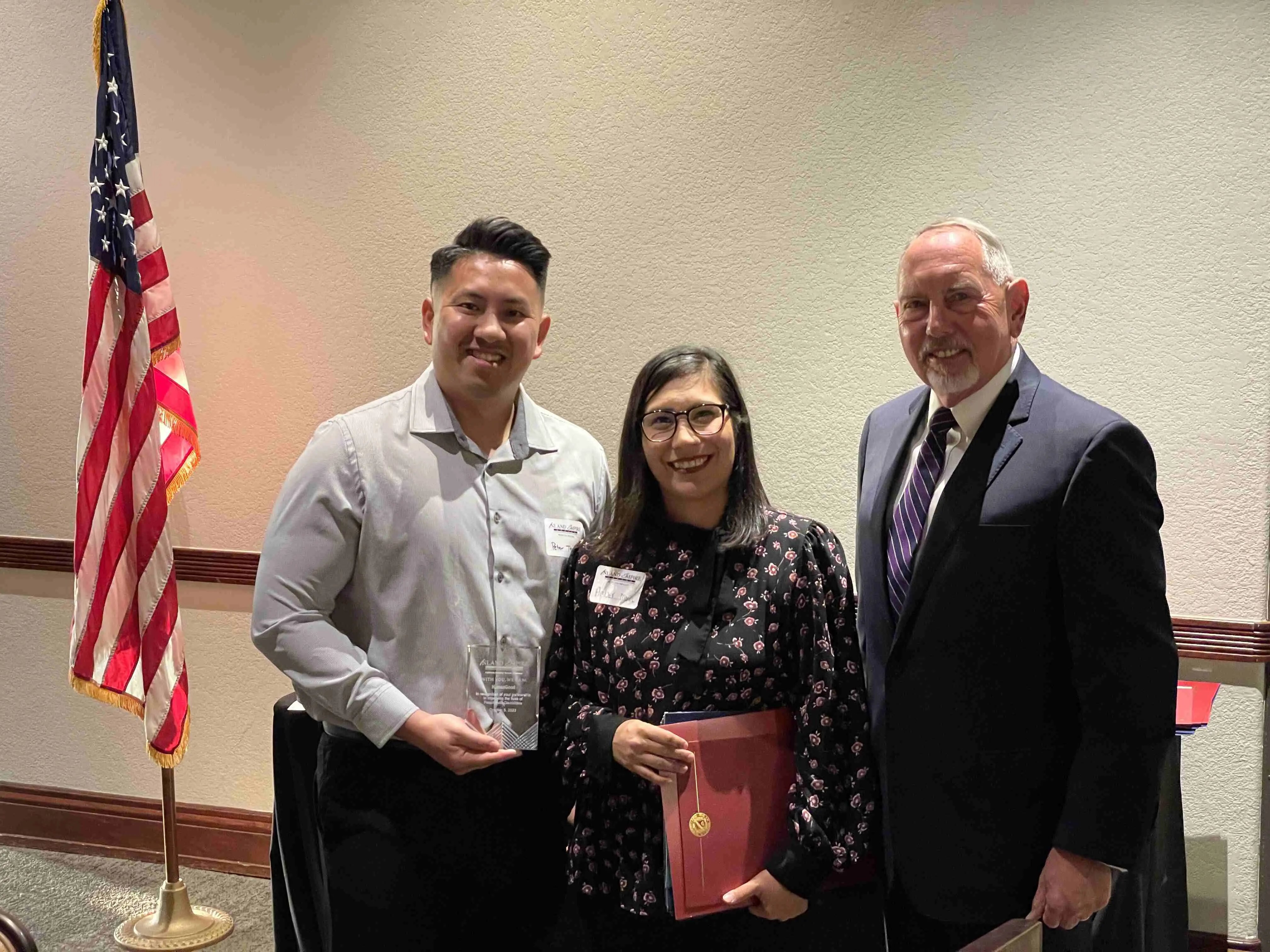 Peter Tran, Amber Mora, and Senator Richard D. Roth.