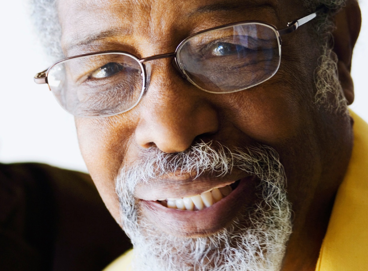 Close-up of smiling senior man wearing glasses