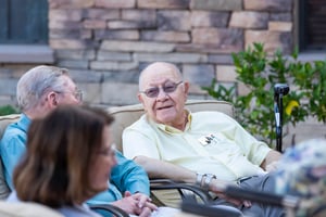 Seniors sitting on an outdoor patio at Las Ventanas