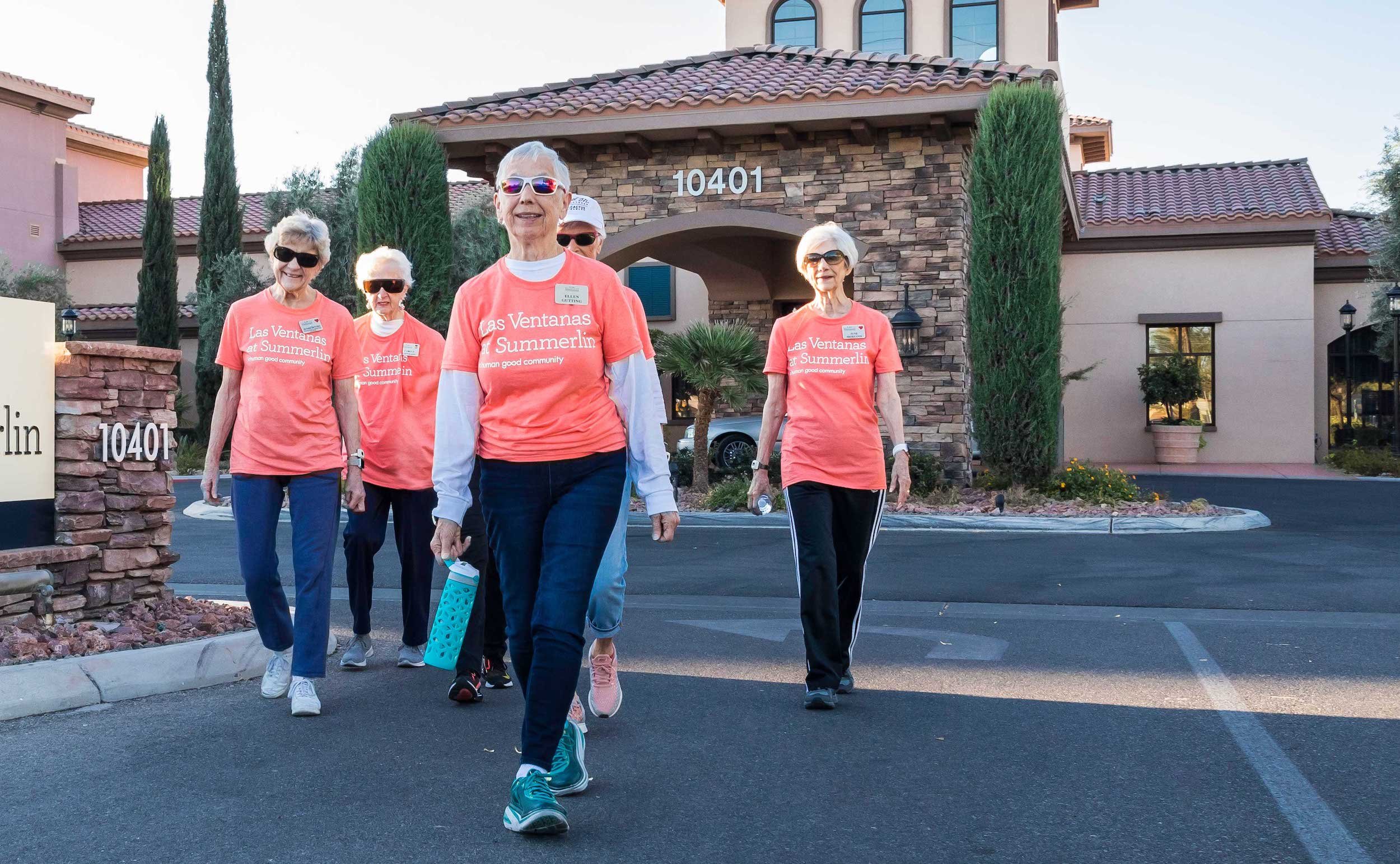 walking group in orange t-shirts 