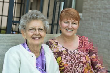 Two women sitting on a bench