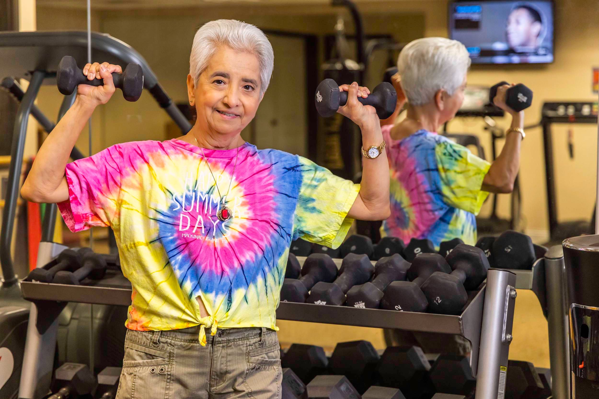 woman in tie dye shirt working out