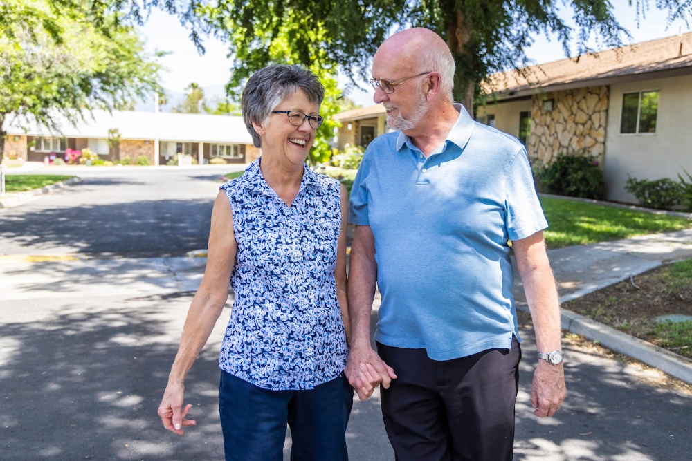 Couple holding hands and enjoying an outside walk