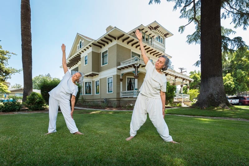 residents enjoy yoga outside