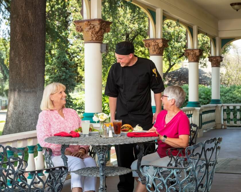 residents enjoy dining outside with chef