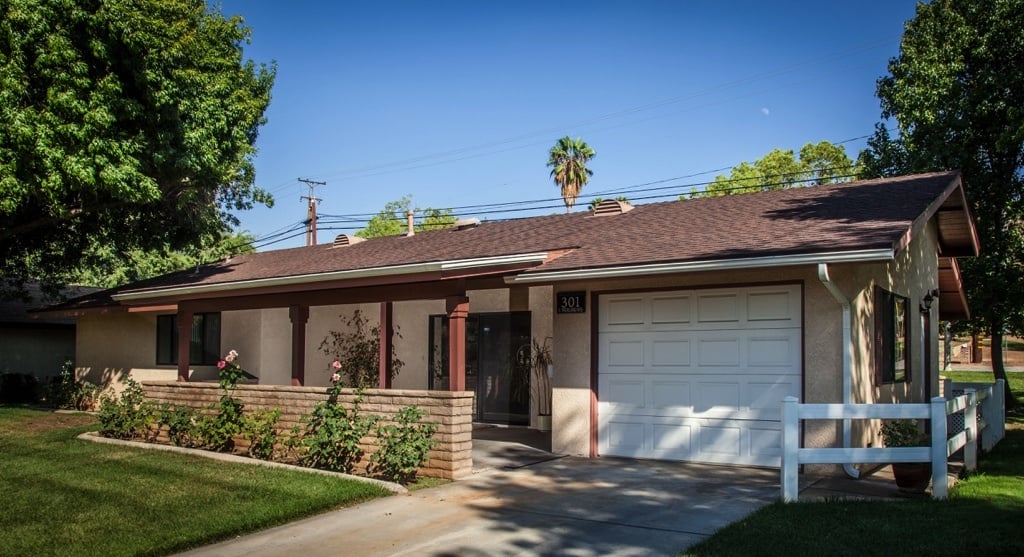 House with brown roof and white garage door