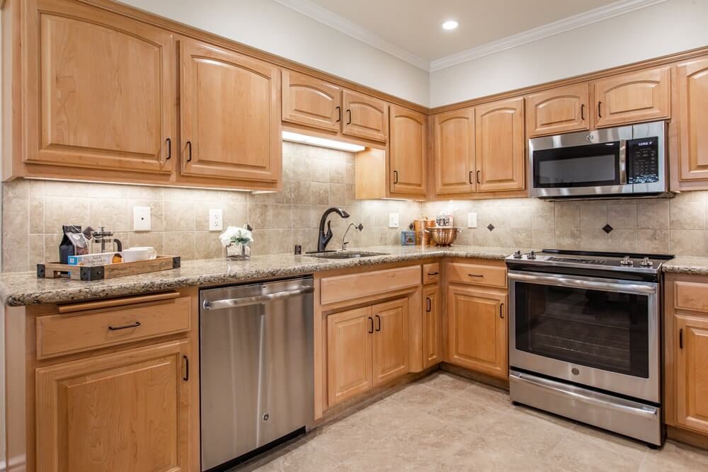 Kitchen with granite countertop and stainless steel appliances