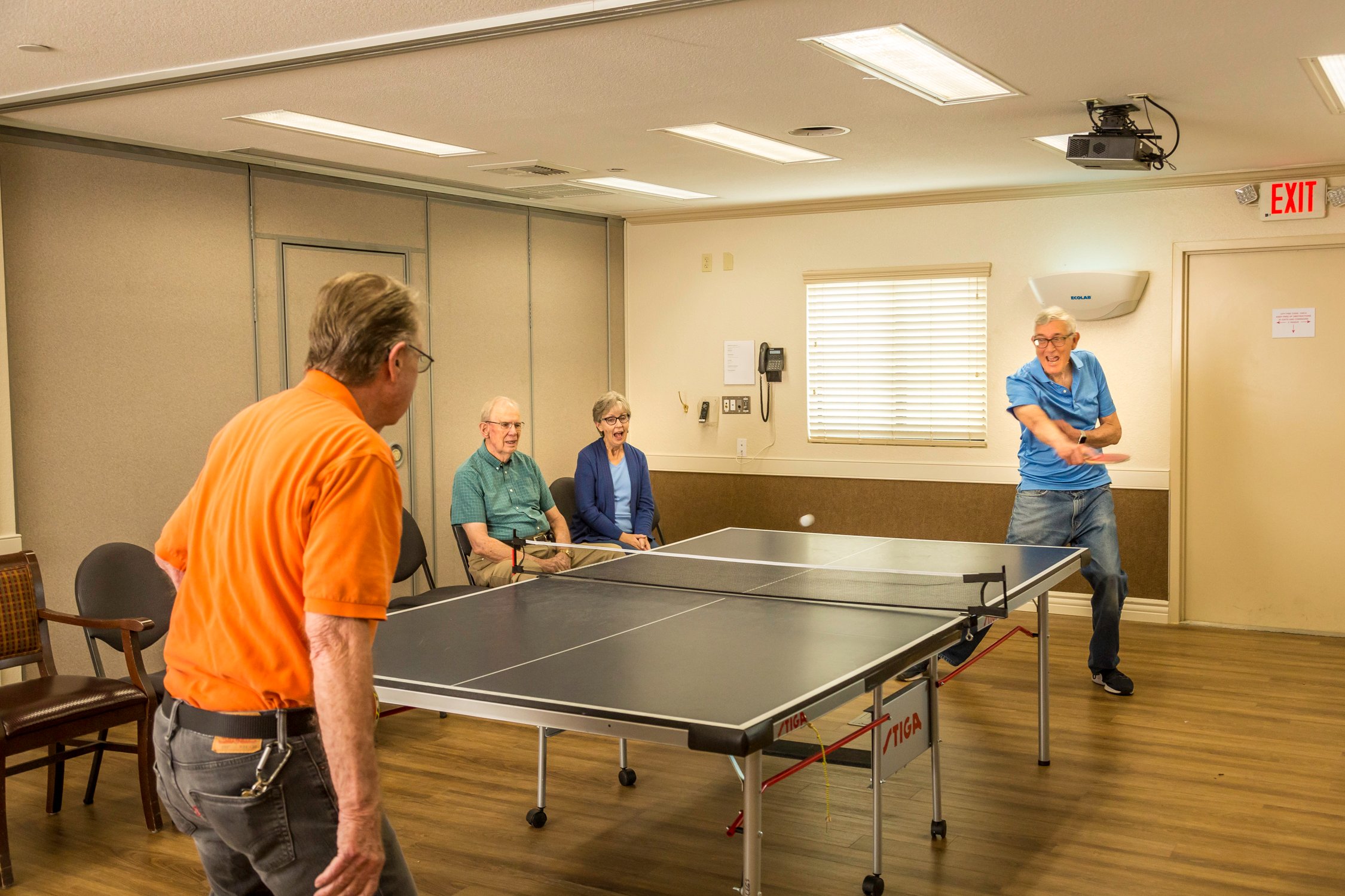 Two men play ping pong