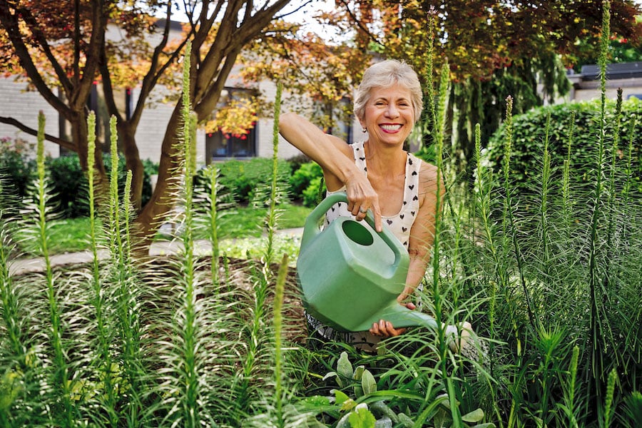 woman watering garden