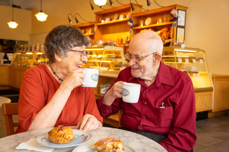Senior couple enjoying a cup of coffee in a cafe