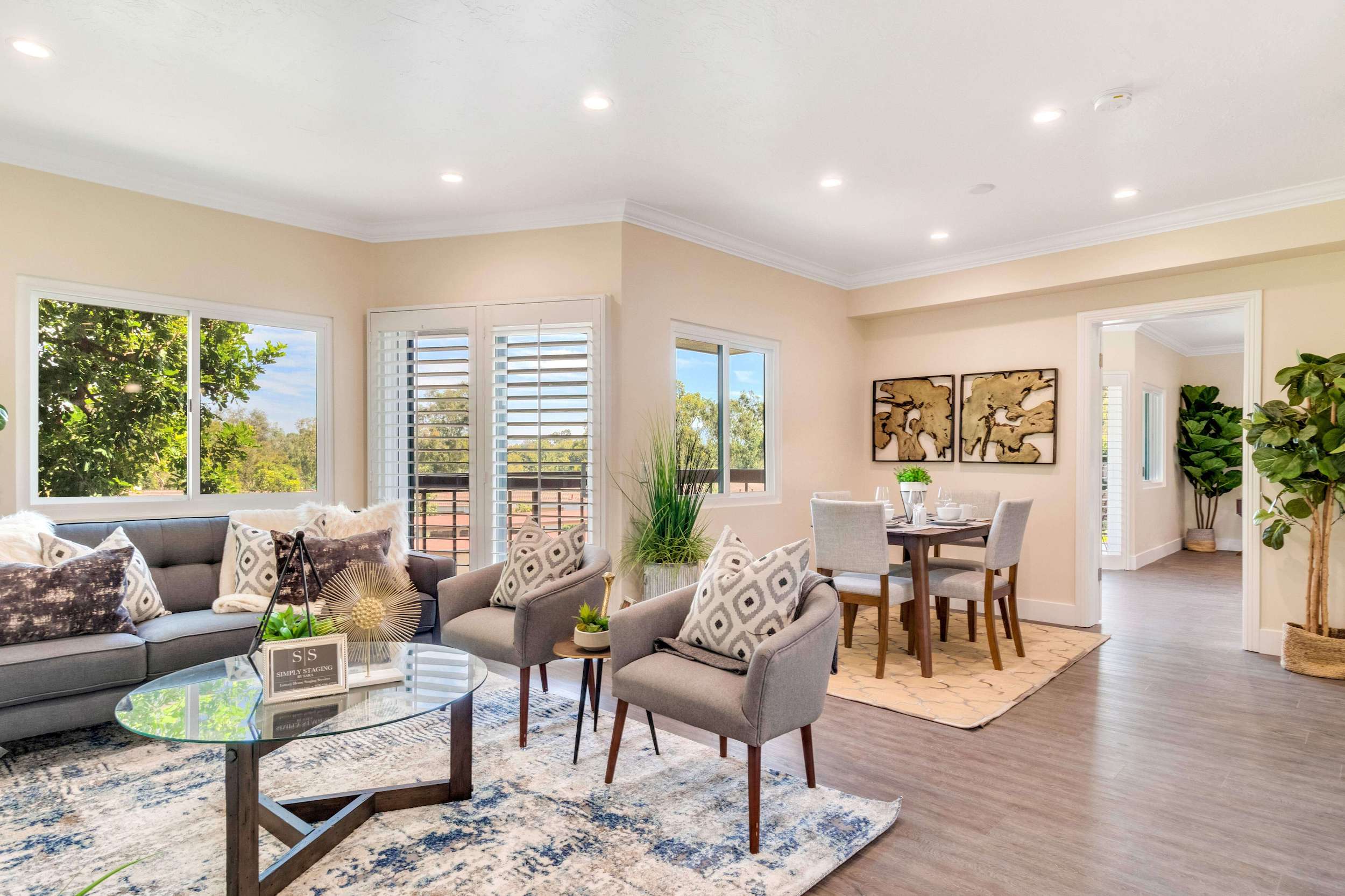 Furnished living and dining room inside a Regents Point apartment home