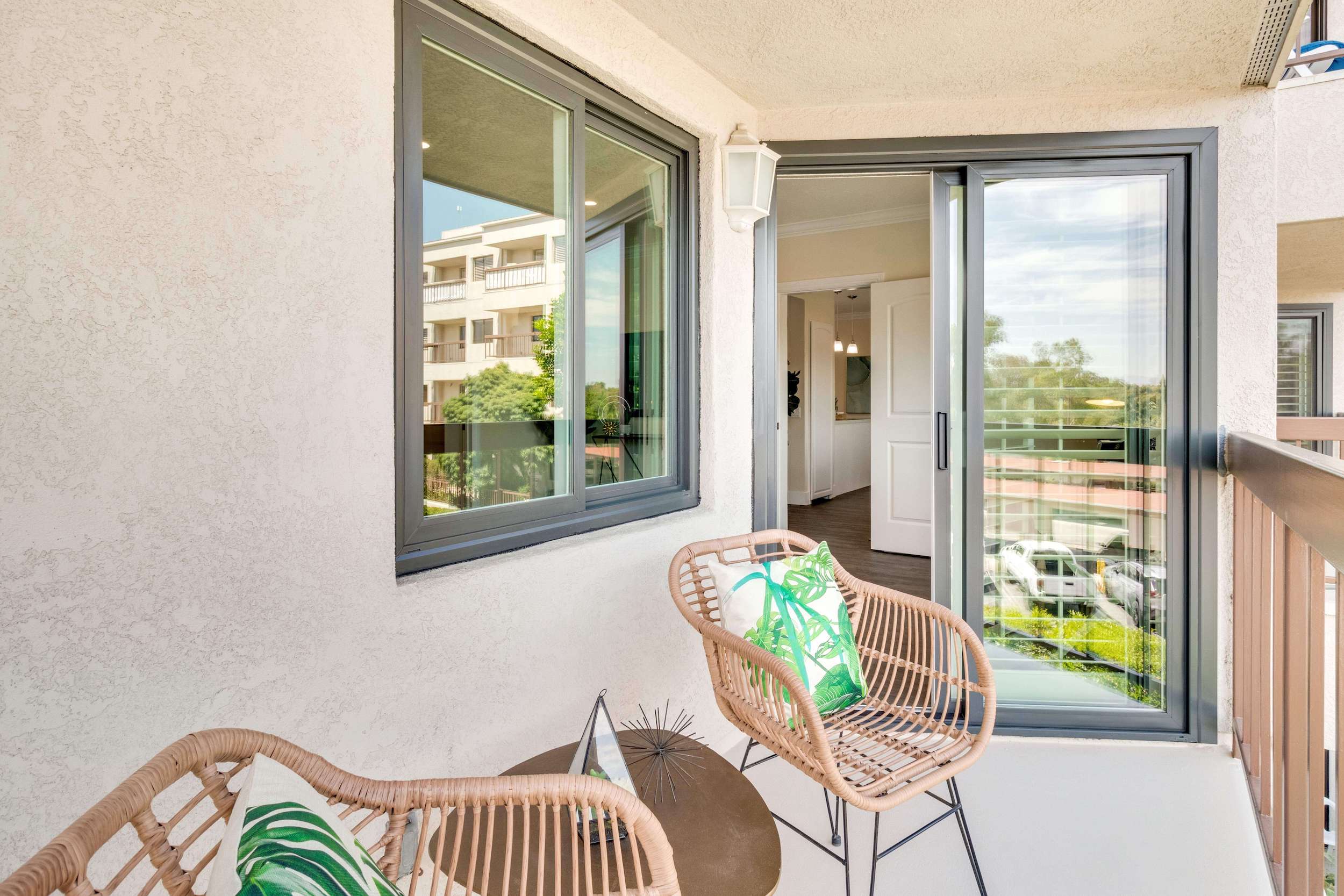 Patio furniture on balcony of Regents Point apartment home