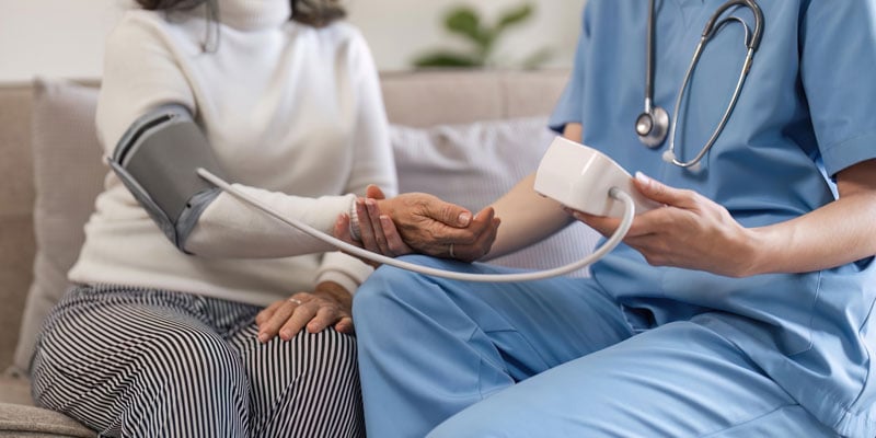 nurse taking a patient's blood pressure