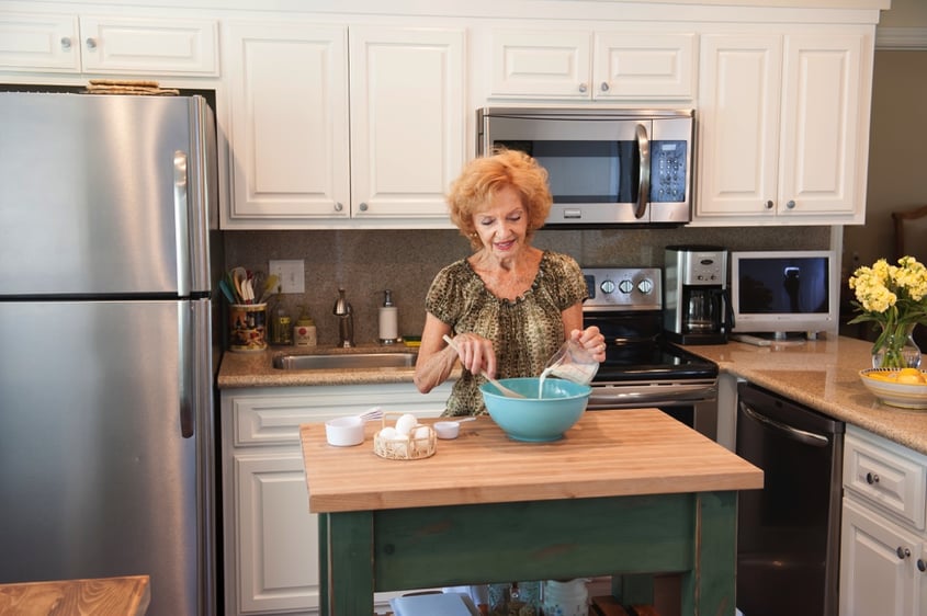 Senior woman baking in her kitchen