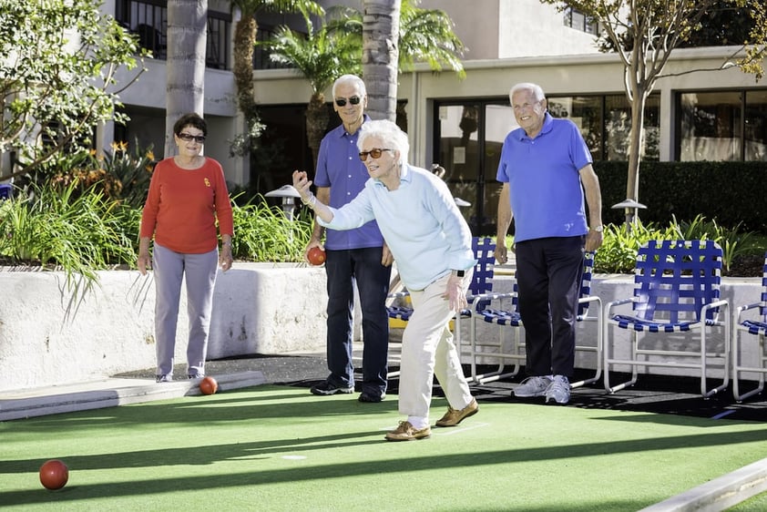 A group of residents playing a game of bocce ball
