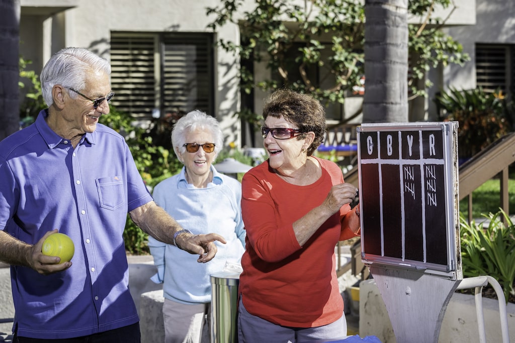 A group of residents tallying the bocce ball score