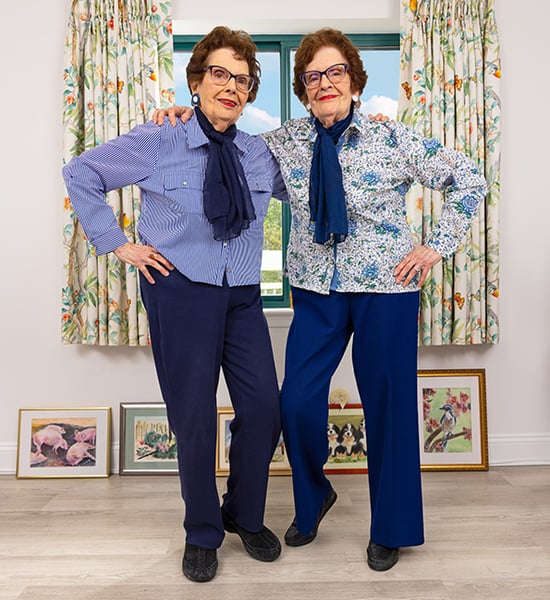 Barbara and Carole smiling next to each other