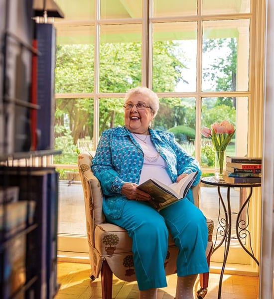 Suzanne sitting inside library