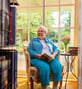 Suzanne sitting inside library