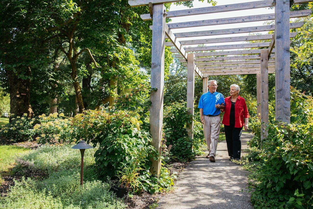 Two residents walking outdoors