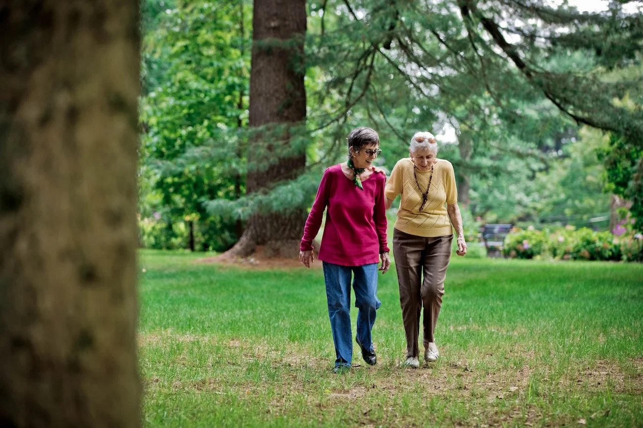 Two senior women walking outside