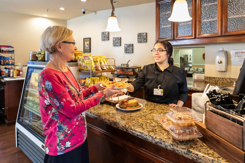 Woman taking food at bistro counter