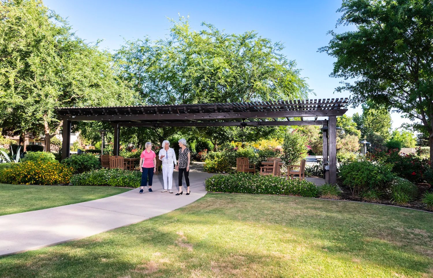 Ladies standing near large pergola
