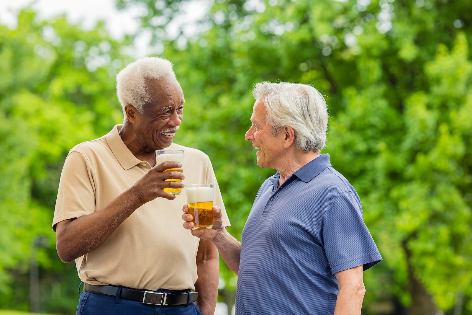 two men having a beer outside