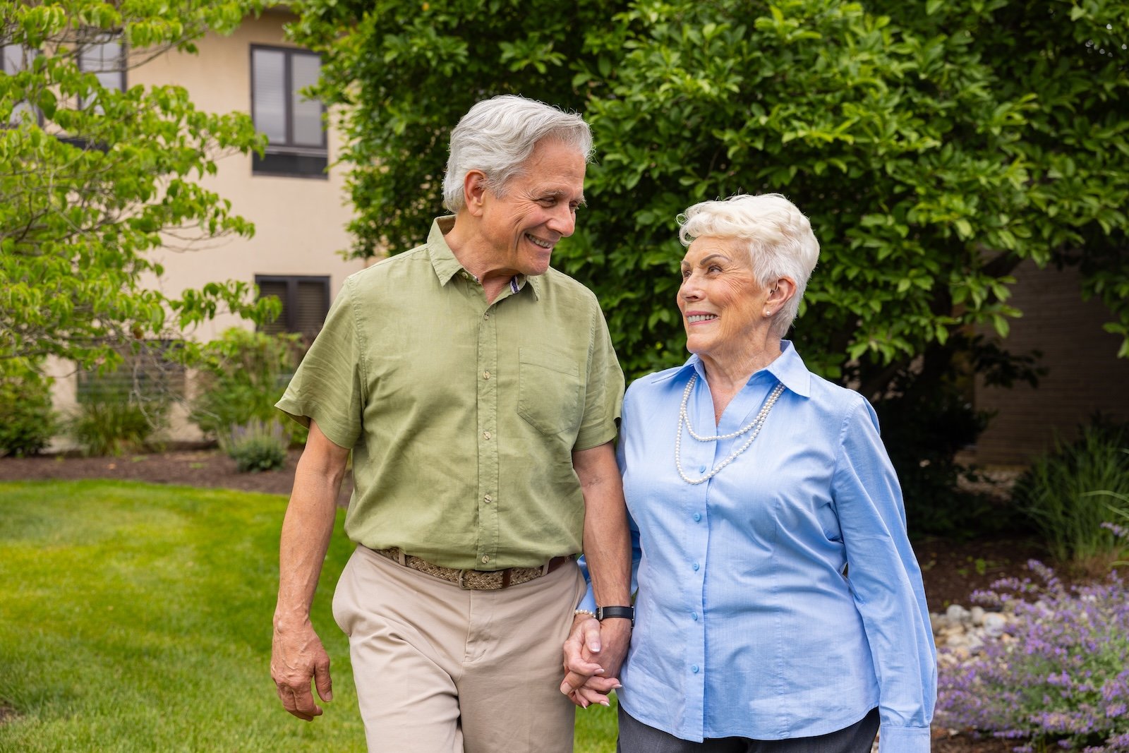 couple holding hands outside