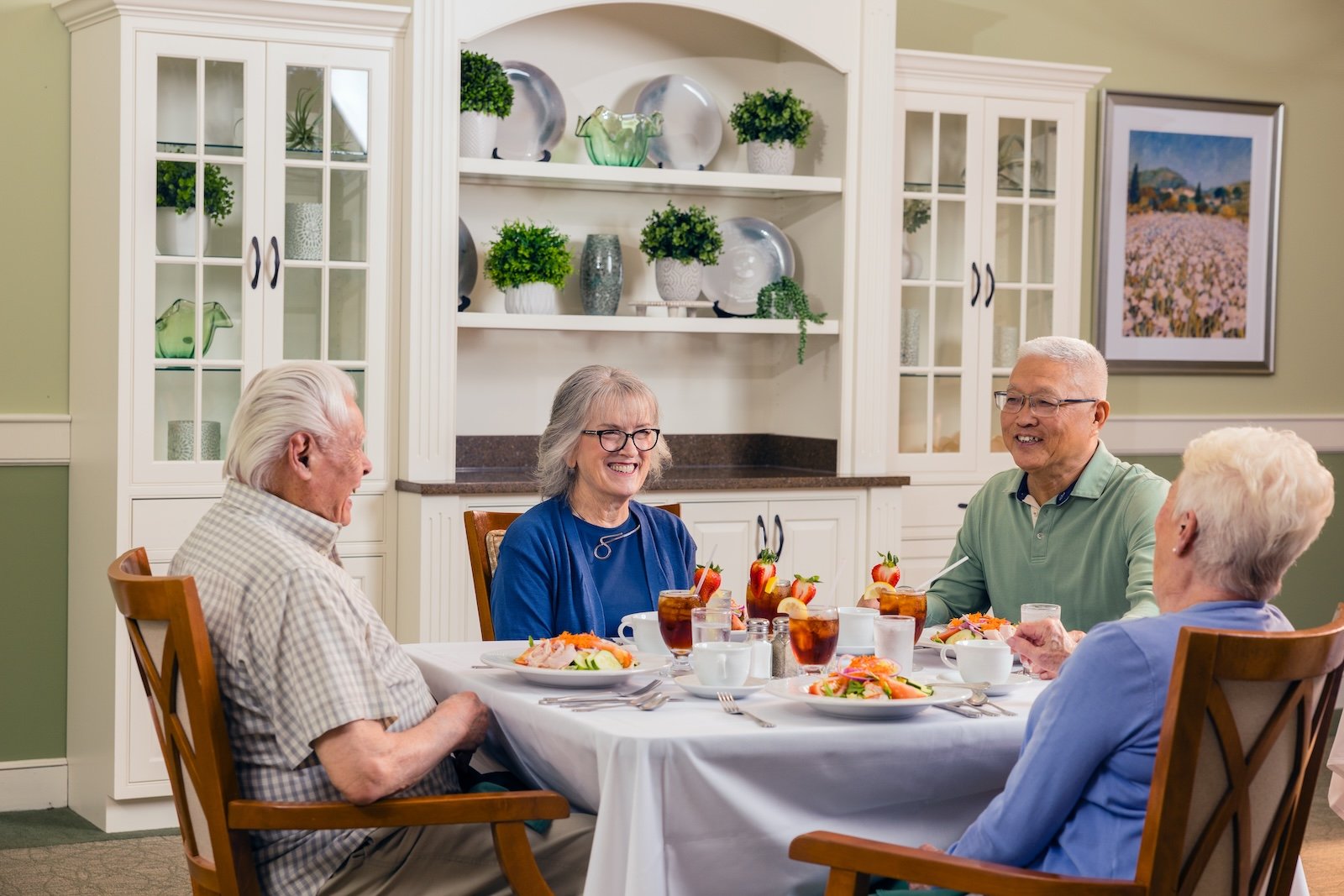 group of residents eating in dining room