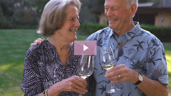 Senior couple enjoying  a glass of white wine