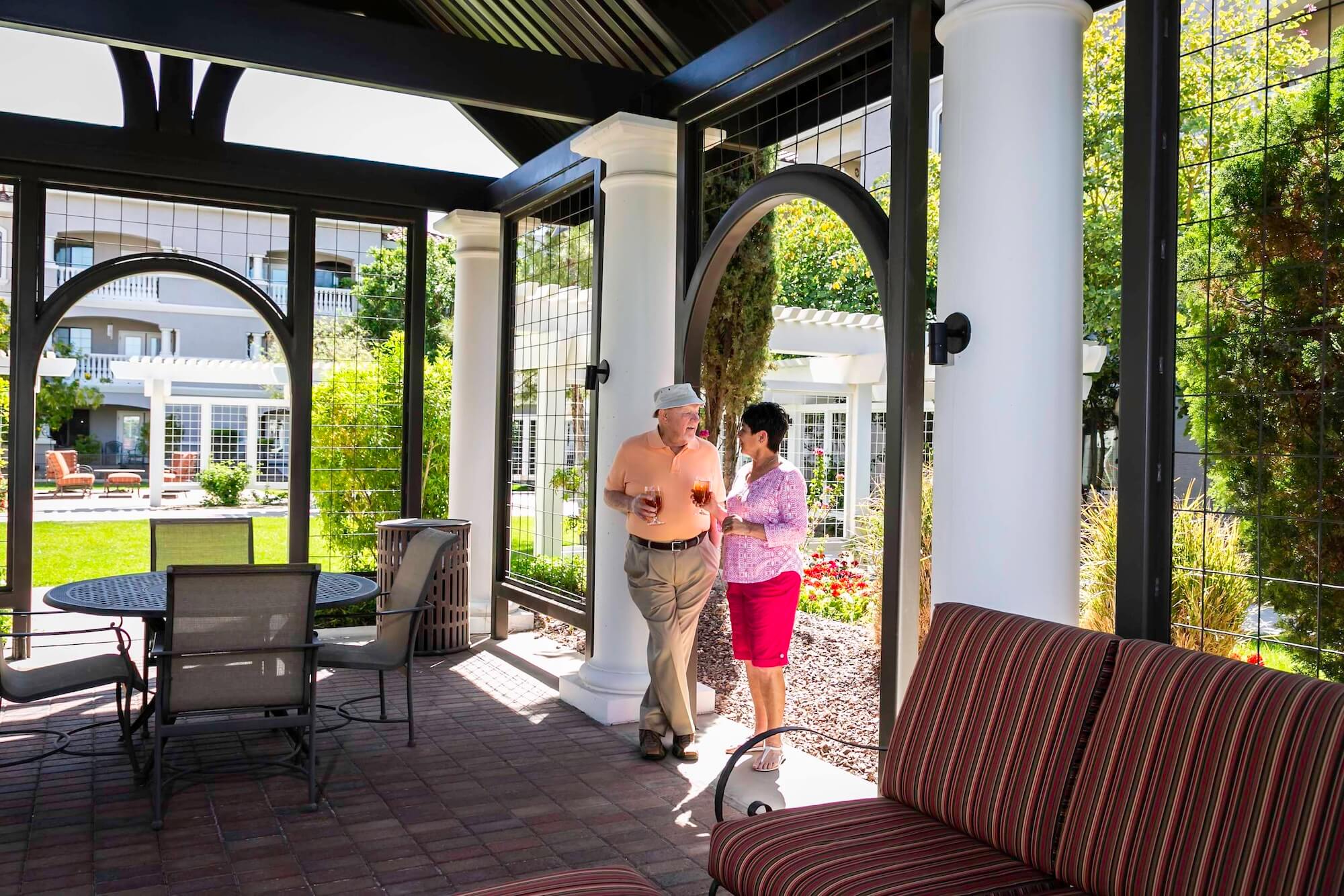couple walking inside gazebo