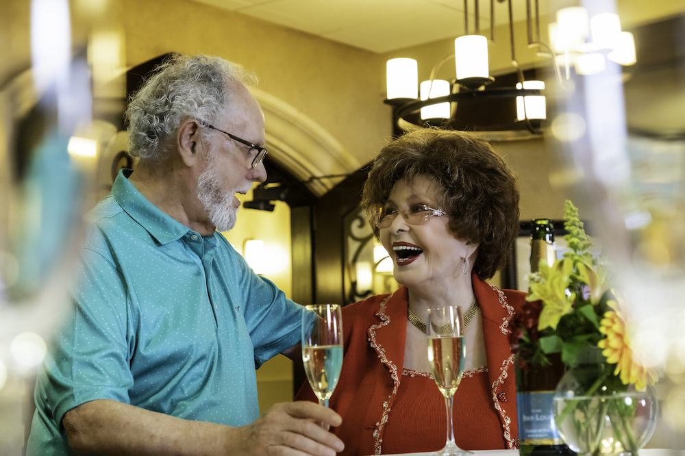 A senior man and woman with Champagne glasses