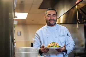 Chef carrying a plate