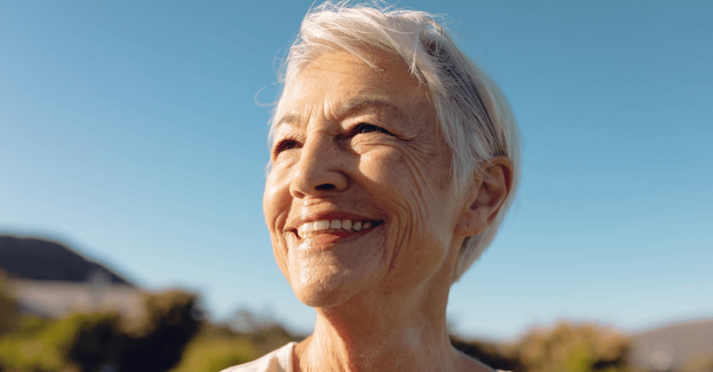 senior woman smiling outside
