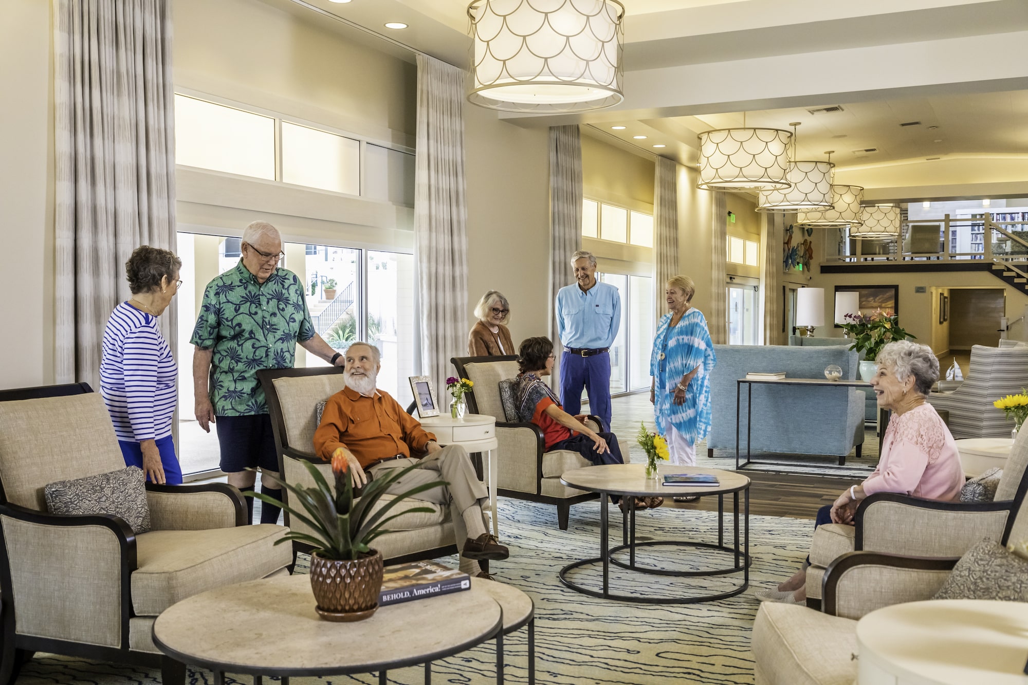 White Sands La Jolla residents gather in a warmly lit lounge.