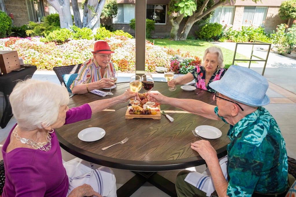 Four friends toasting a drink